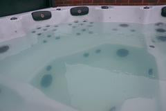 Why has my hot tub water turned green?