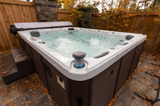 
Hard-shell hot tub with crystal-clear water surrounded by autumn leaves