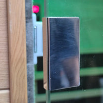 Metallic rectangular object on a blurred background