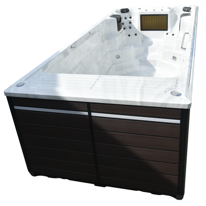 Canadian Spa 19ft St. Lawrence swim spa — angled view showing dark wood-effect cabinet and open acrylic shell — KS-10034